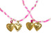 Necklace with gold heart pendants and pink and white bead chain on a white background